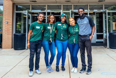 Students and Community Director in front of Holden Hall 